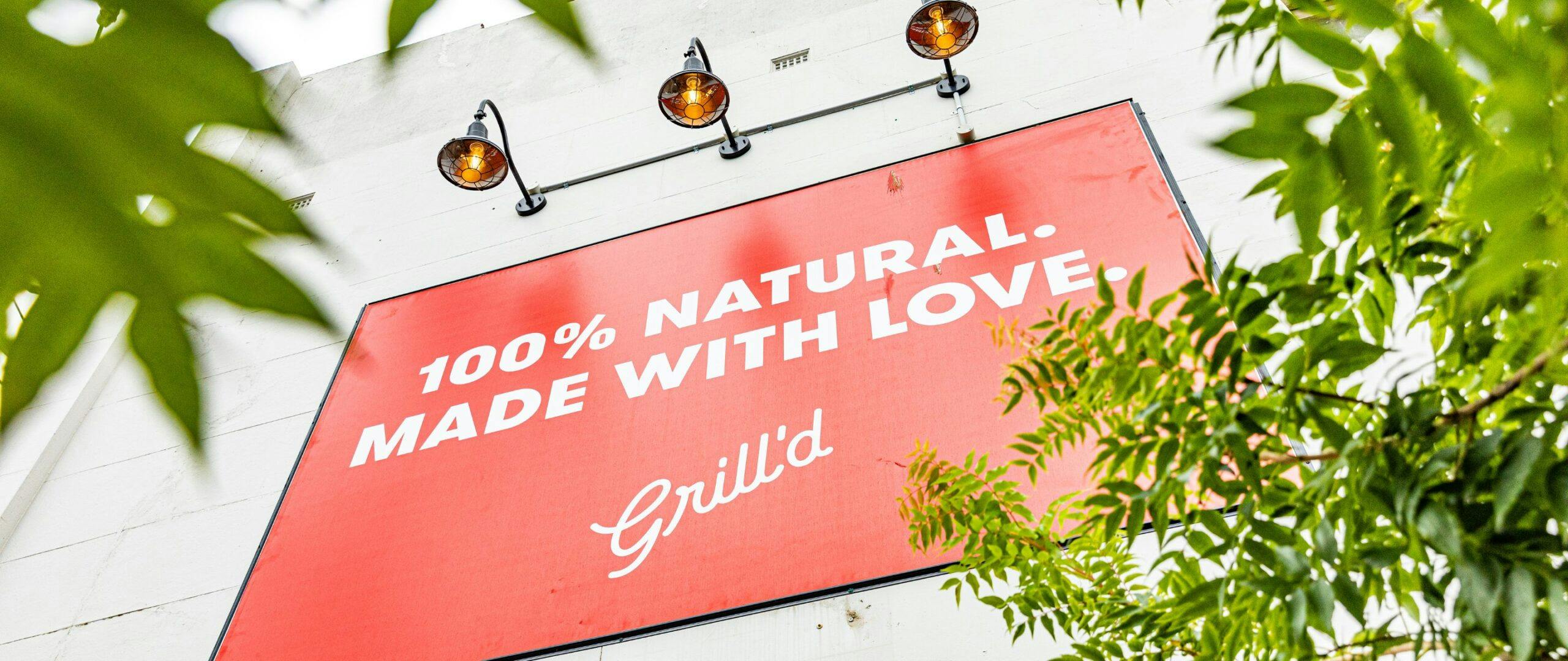 Grill'd billboard saying "100% natural made with love"